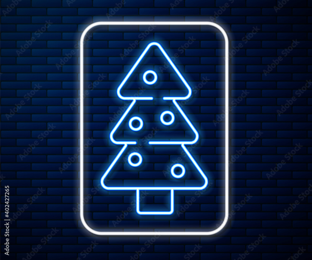 闪闪发光的霓虹灯圣诞树，装饰图标隔离在砖墙背景上。圣诞快乐