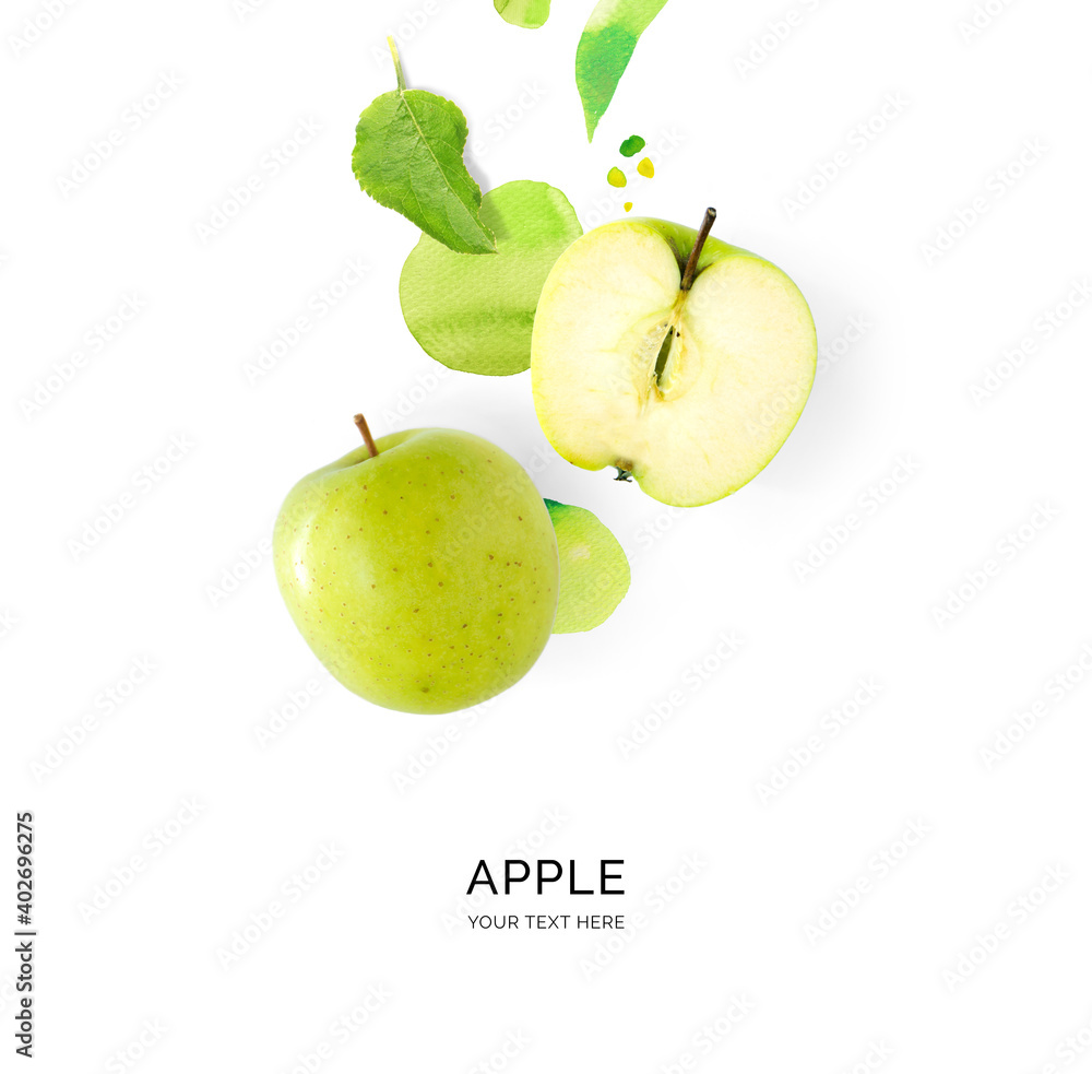 Creative layout made of green apple with watercolor spots on the white background. Flat lay. Food co