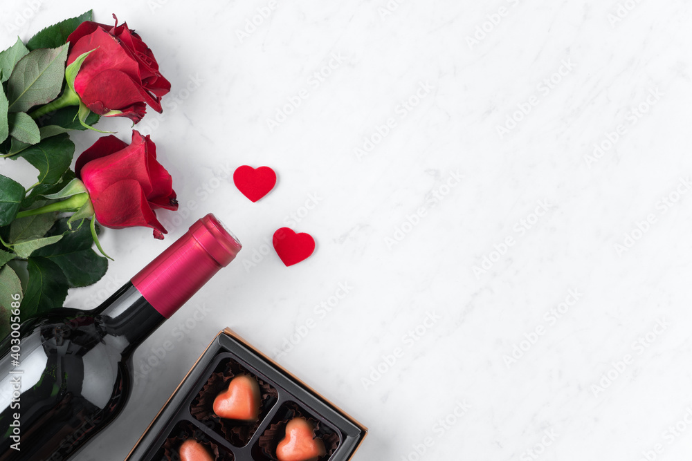 Top view of Valentine day chocolate with rose and wine, festive gift design concept