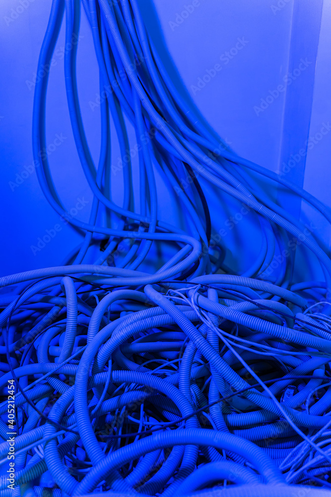 Pile of cables on floor in new building. Electricity installation and interior renovation. Closeup.