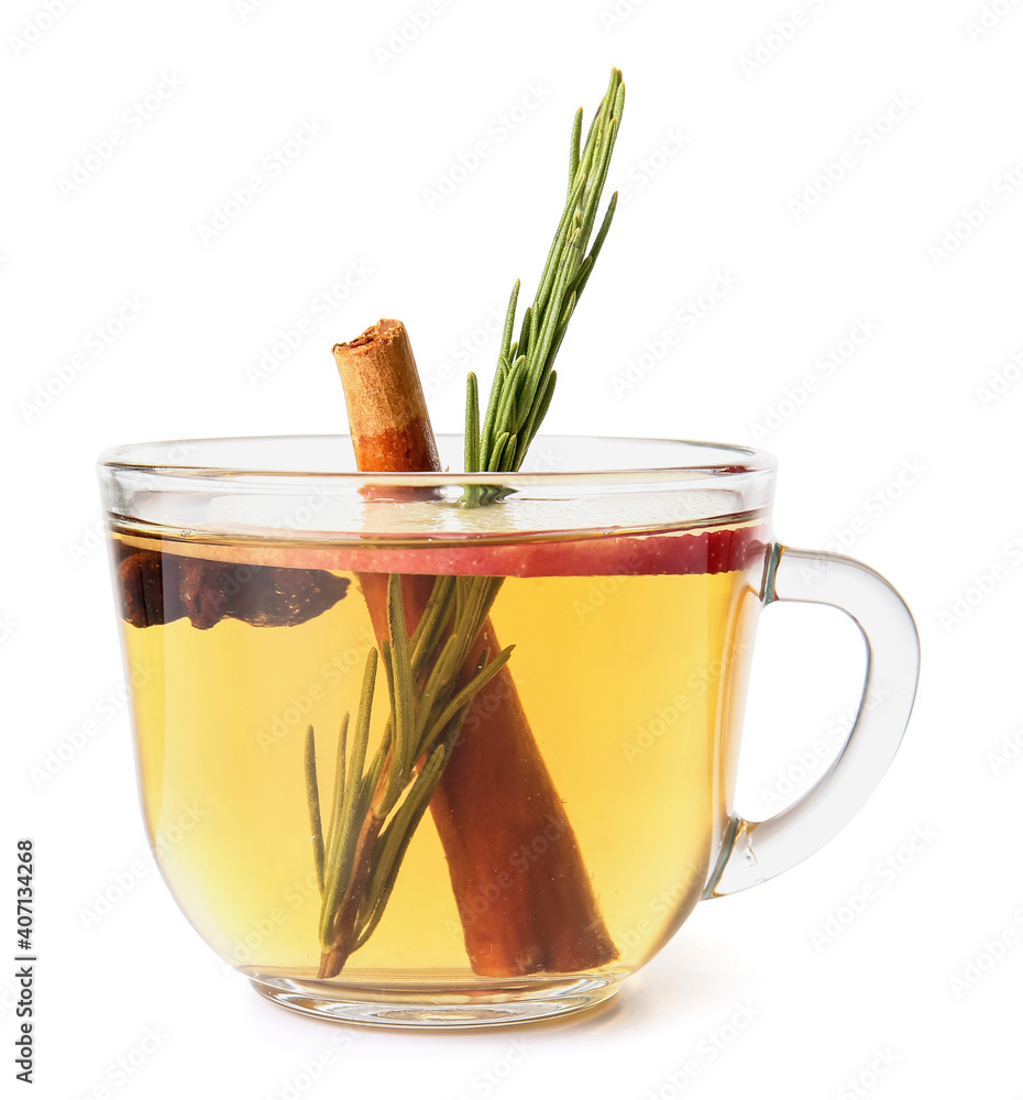 Tasty drink with spices and apple slices in cup on white background