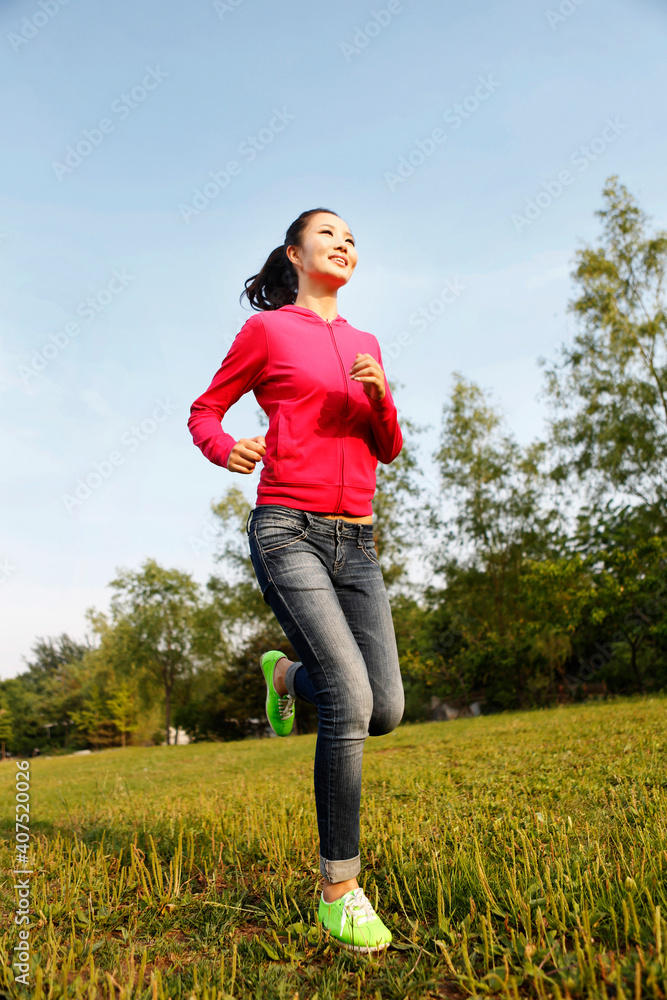 Young woman running outdoors