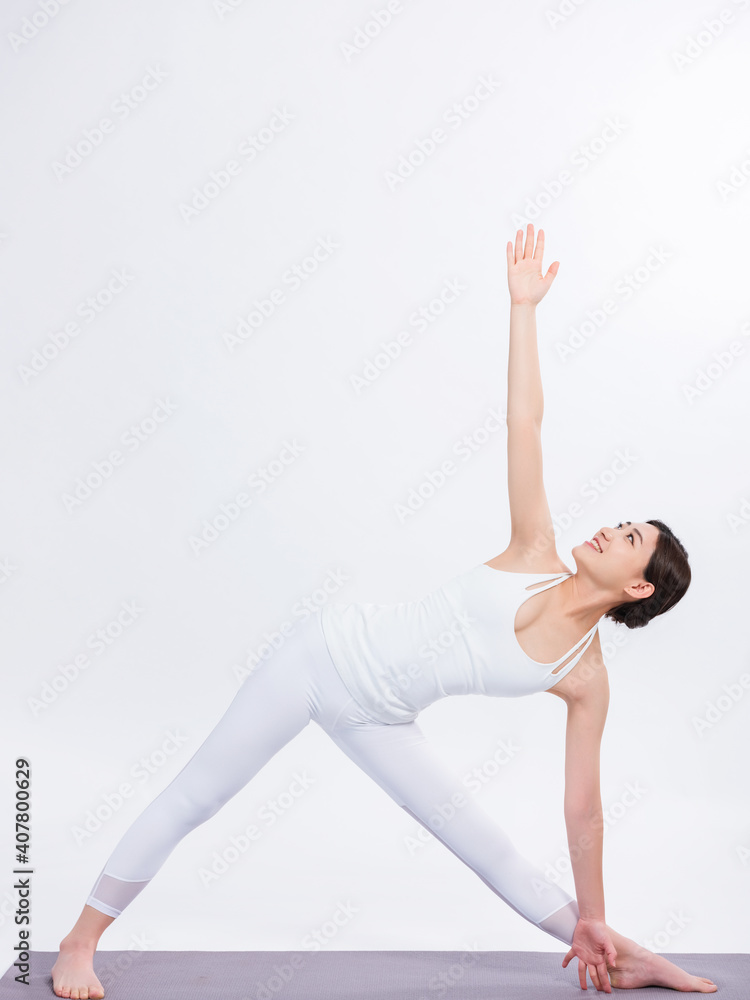 Young women practice yoga