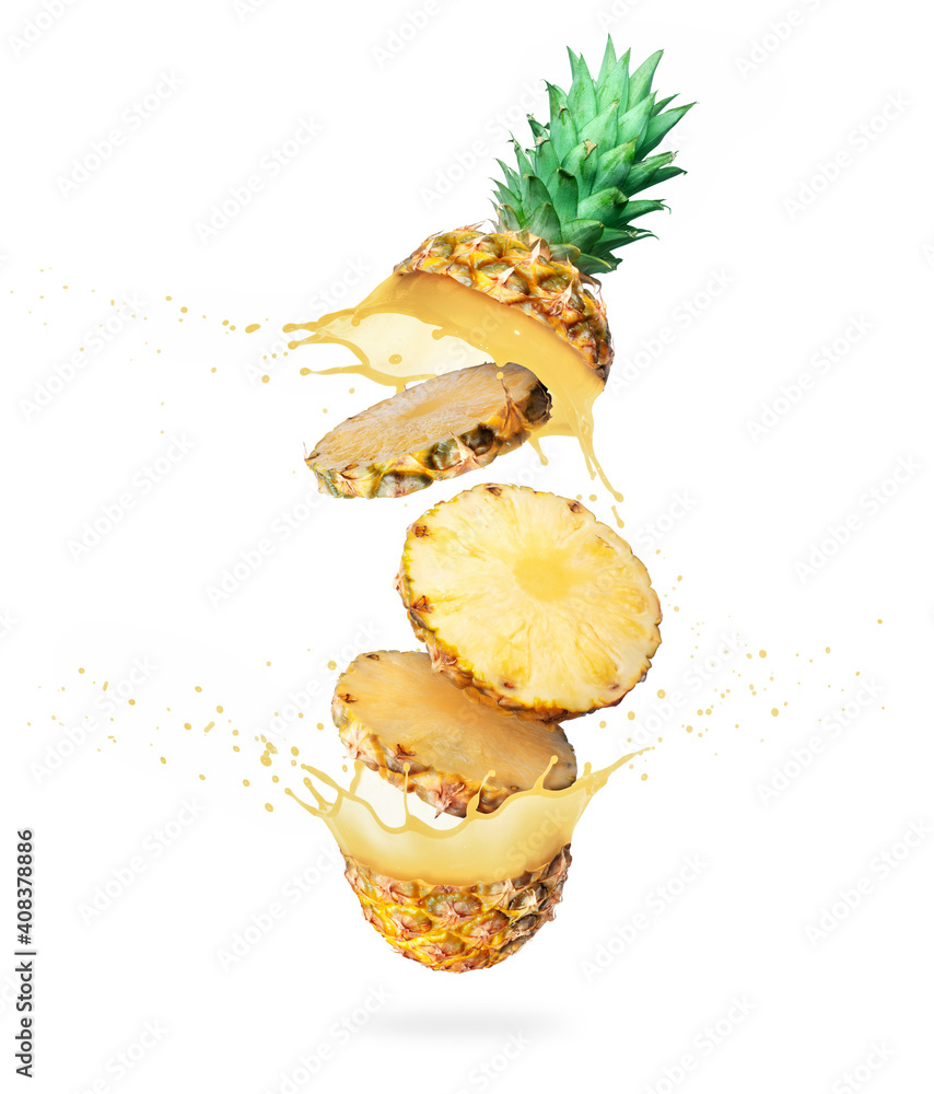 Sliced pineapple with splashing of juice in the air on white background