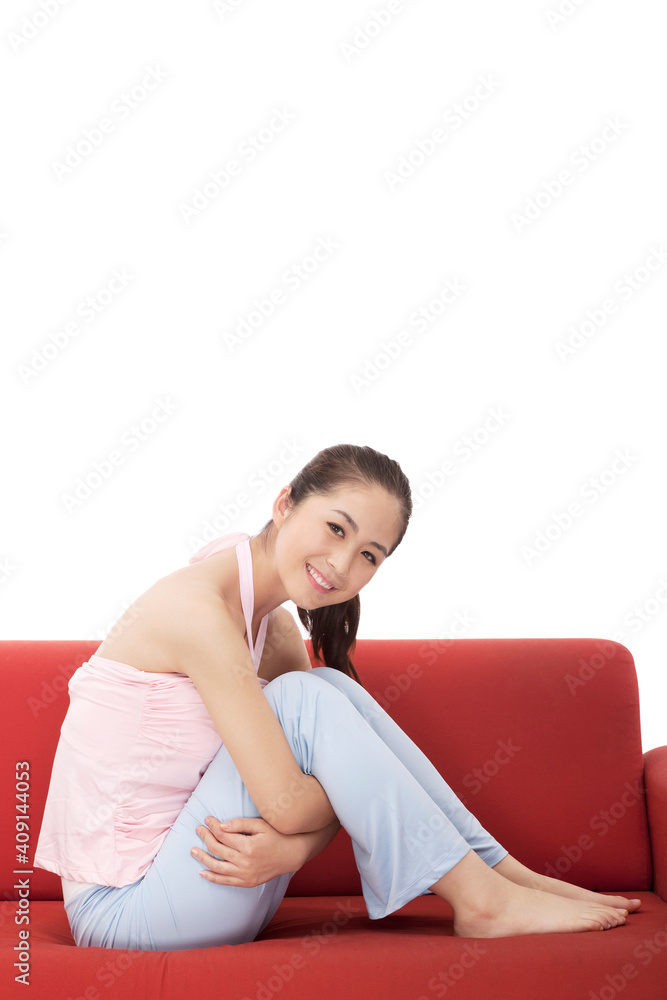 Young fashion woman sitting on sofa