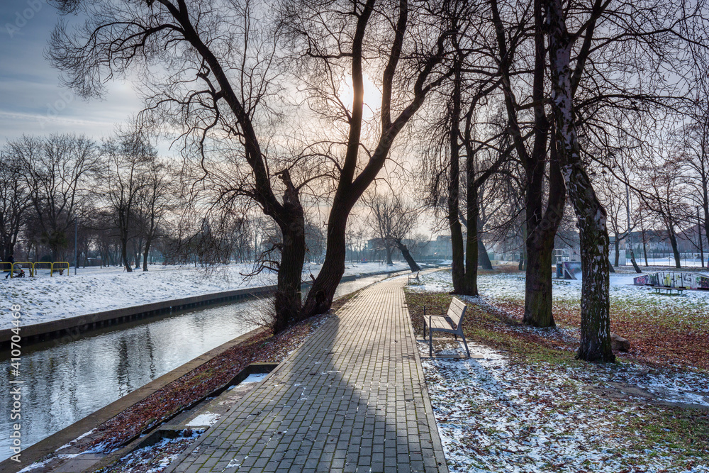 Pathway by the Radunia river in the winter park, Pruszcz Gdanski. Poland