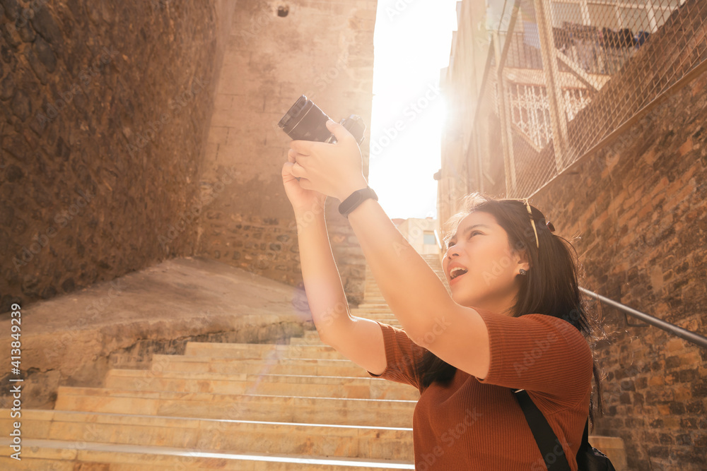 attractive asian female traveller tourism hand use camera sightseeing old stone stair hallway in car