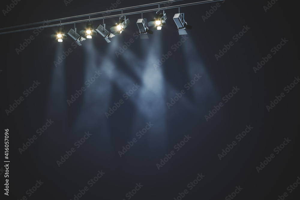 Black rail with spotlights and beams of light in the smoke at dark background