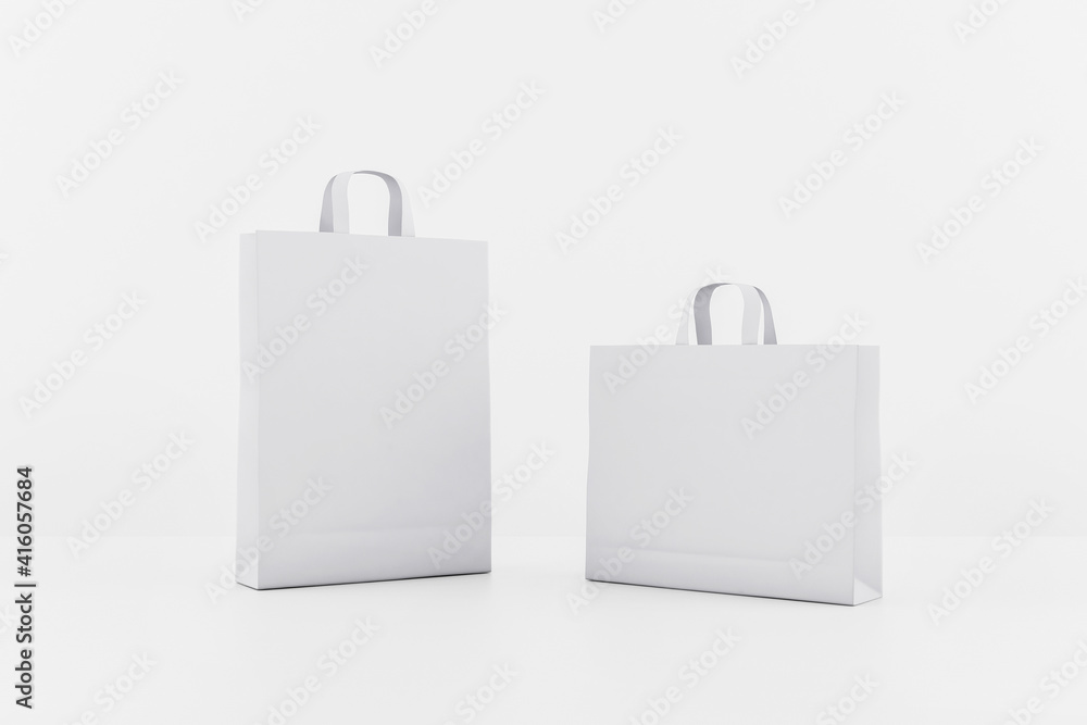 Blank white paper bags with a space for your logo. Mockup