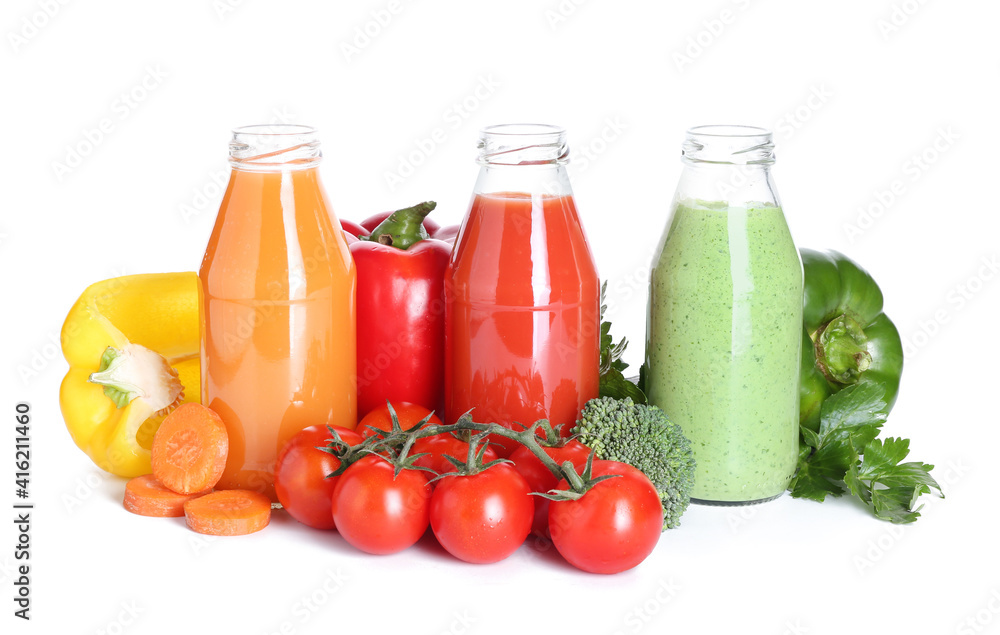 Bottles of healthy smoothie with different vegetables on white background