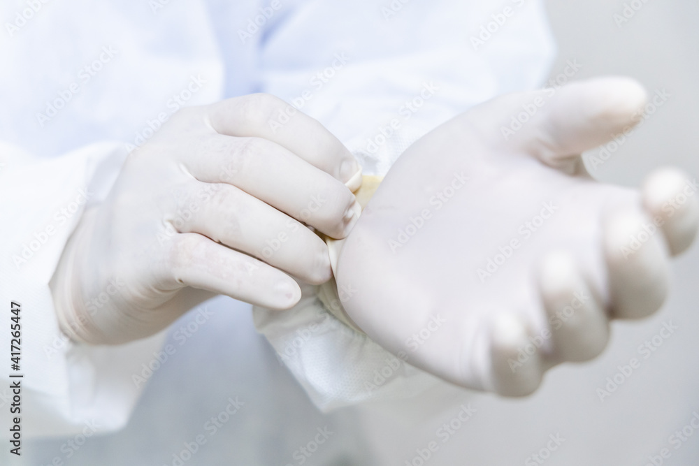 Doctor hands with white surgical gloves, Latex Glove, Rubber glove manufacturing, human hand is wear