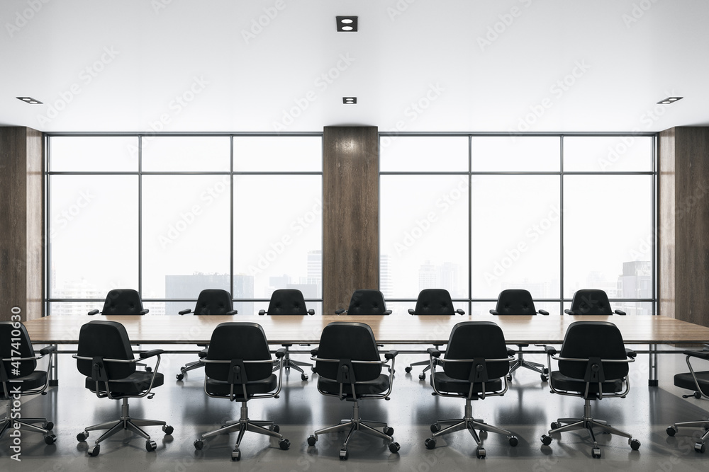 现代宽敞的会议室，有大窗户，中央有木桌，周围有黑色椅子