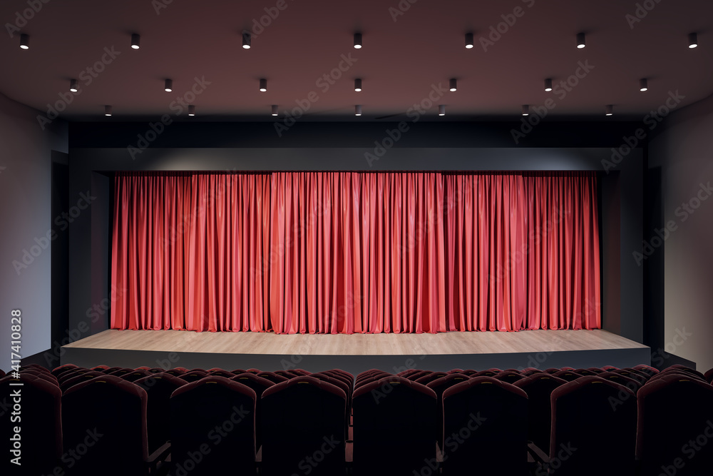 红色窗帘、一排排座位和顶部有灯的空旷场景的前视图