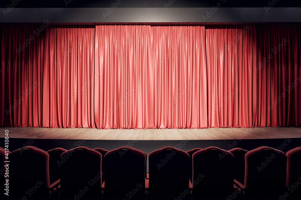 空荡荡的剧院大厅，有木制舞台、红色窗帘和一排座位