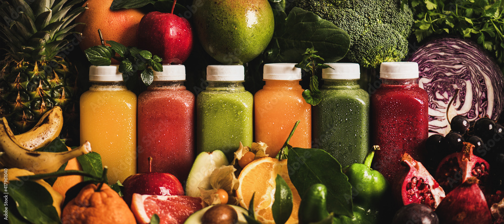Fresh smoothies or juices for detox weight loss diet. Colorful juices in vacuum bottles with fruit, 