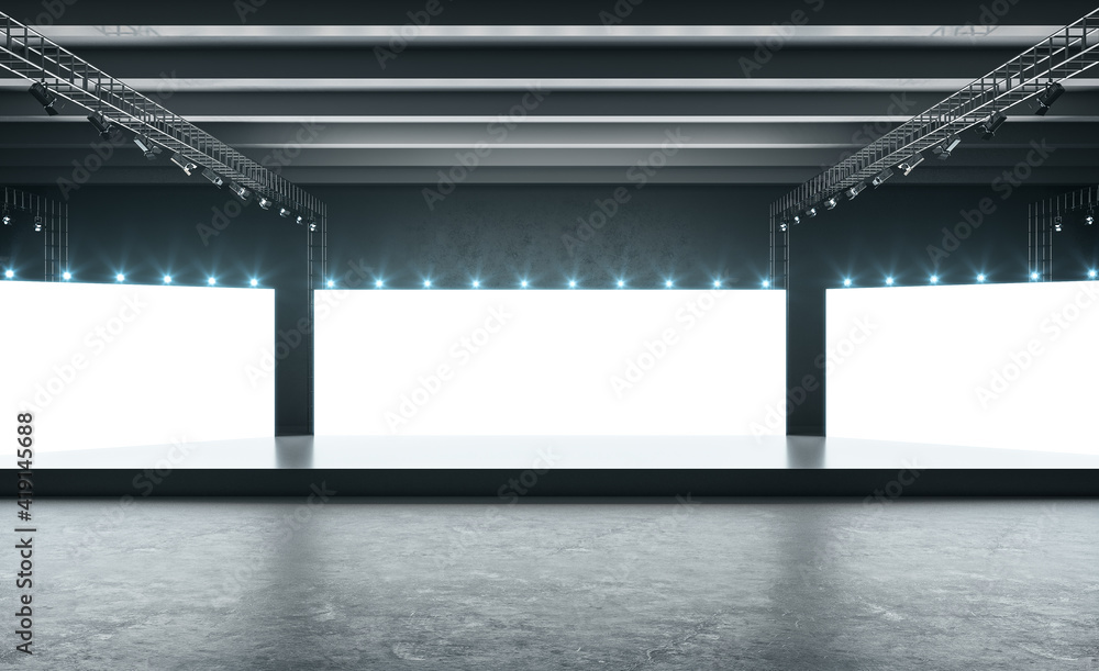 空荡荡的展厅里的白色屏幕，黑色的讲台，深色的混凝土地板和灯光