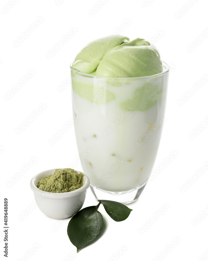 Glass of tasty dalgona matcha latte and powder on white background