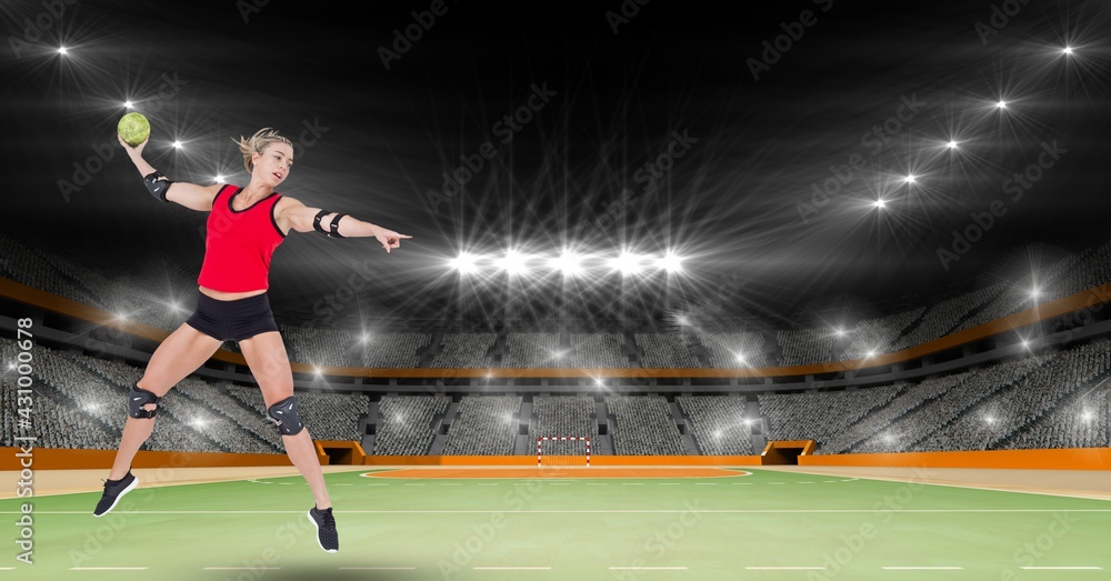 Composition of female handball player in air throwing ball on handball pitch with spotlights
