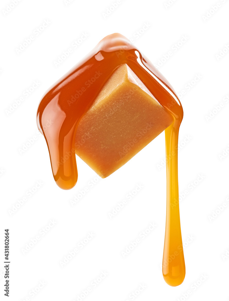 caramel sauce flowing on flying caramel candy