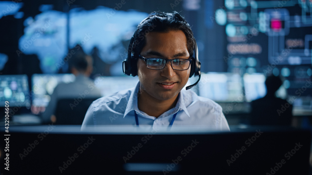 Portrait of Professional IT Technical Support Specialist Working on Computer in Monitoring Control R