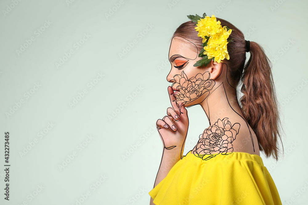 美丽年轻女性的肖像，化妆富有创意，彩色背景上有花朵
