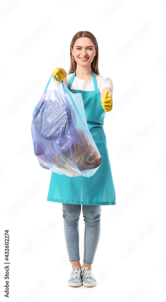 Female janitor with garbage bag showing thumb-up on white background