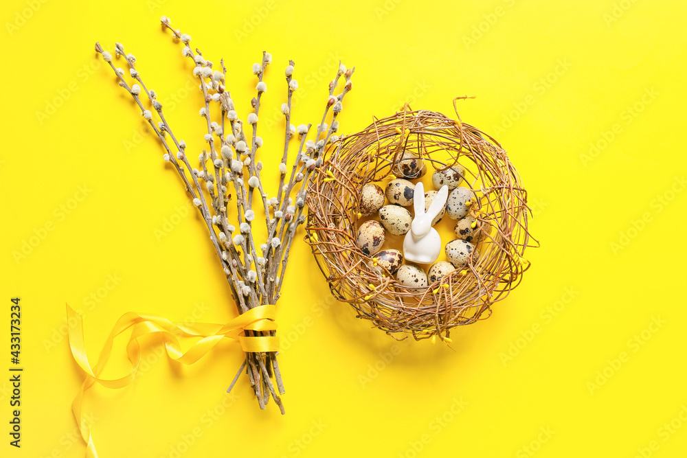 柳树树枝和鸟巢，背景是鹌鹑蛋和复活节兔子