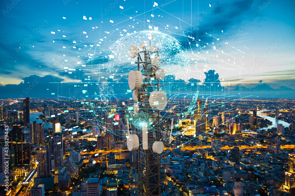 Telecommunication tower with 5G cellular network antenna on night city background, Global connection