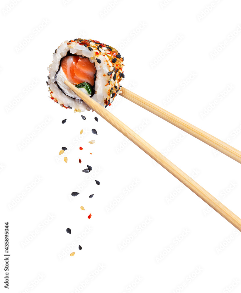 Fresh traditional japanese sushi with salmon and sesame between chopsticks, isolated on white backgr