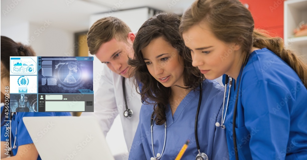 使用带医学研究数据接口屏幕的笔记本电脑的男女医生的构成