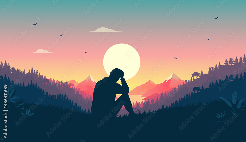Melancholy man sitting in landscape thinking and contemplating. Beautiful warm nature and sunset in 