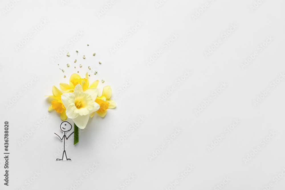 Creative composition with beautiful daffodils and drawn boy on light background
