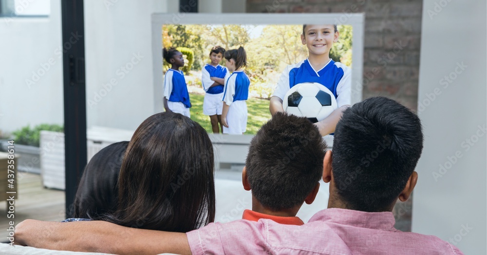 Compostion of family watching diverse children playing football on tv at home