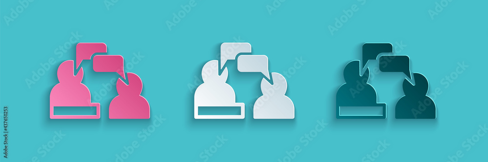 Paper cut Two sitting men talking icon isolated on blue background. Speech bubble chat. Message icon