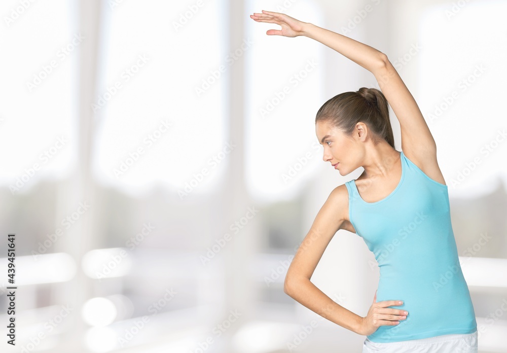 Young happy woman doing stretch. Health care. Body care.