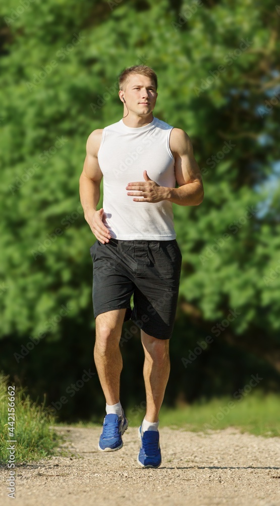 young man running on a rural road