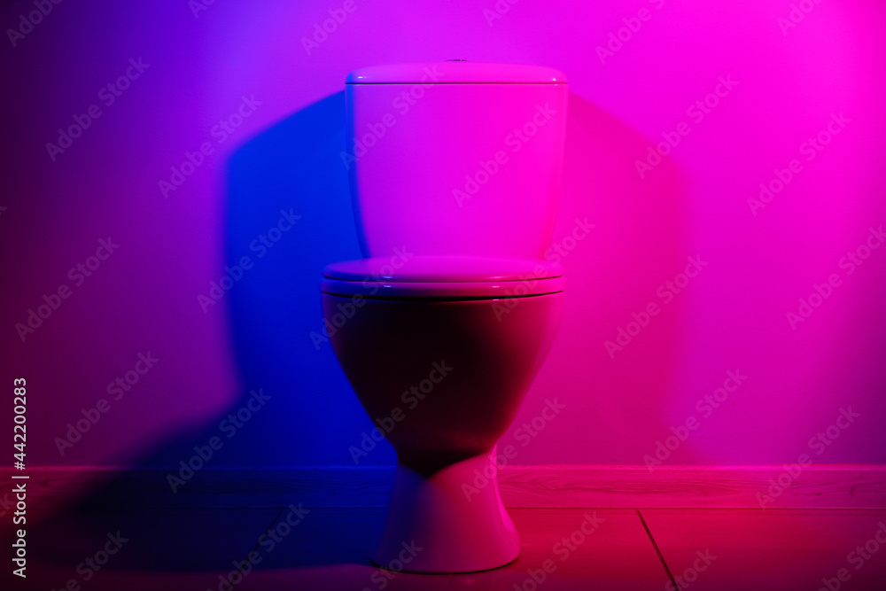 Toilet bowl on dark color background