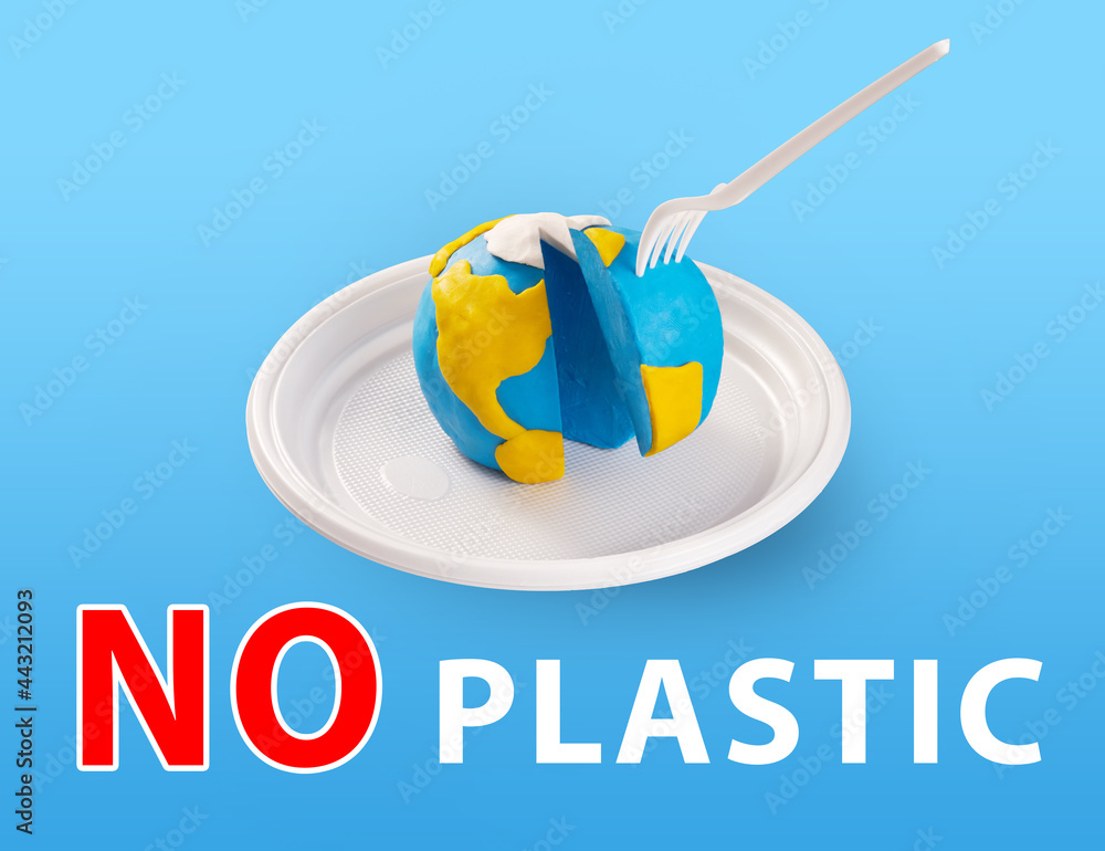 世界地球日概念。无塑料概念。污染问题概念。塑料插头卡在t上