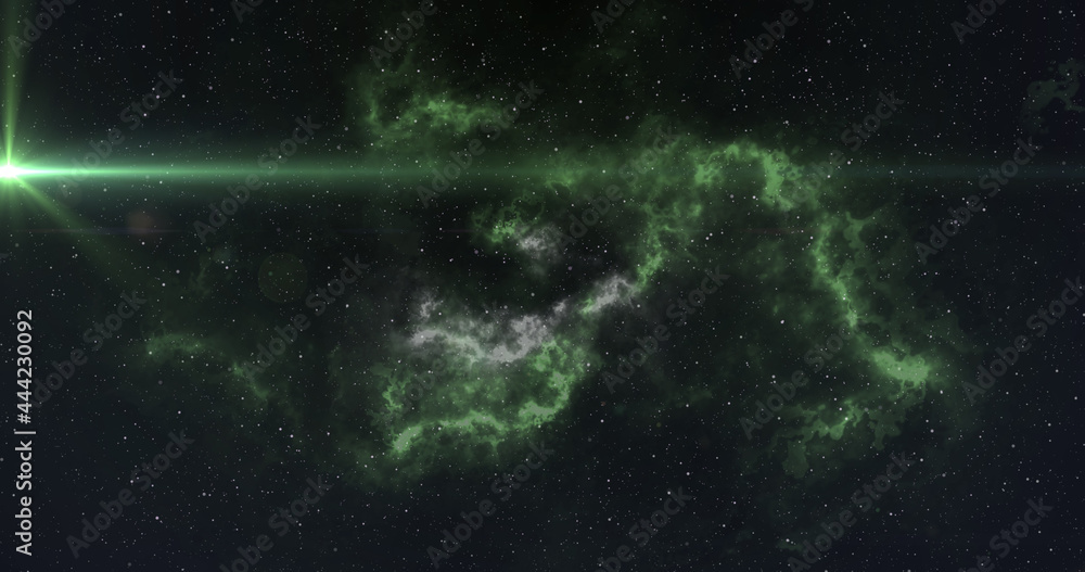 明亮的绿色光点在夜空中的白色和绿色星云上移动