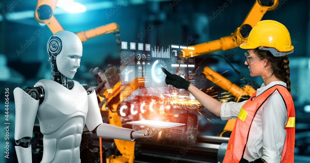 机械化工业机器人和人类工人在未来工厂共同工作。人工的概念