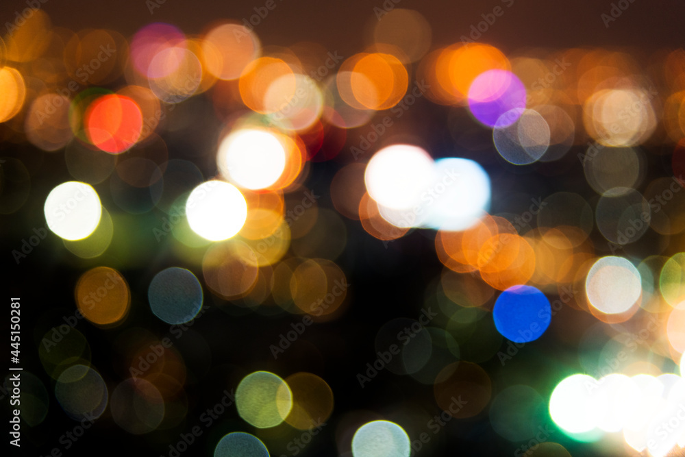 Blurred street bokeh lights at night time