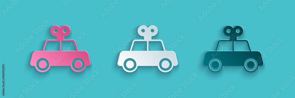 Paper cut Toy car icon isolated on blue background. Paper art style. Vector