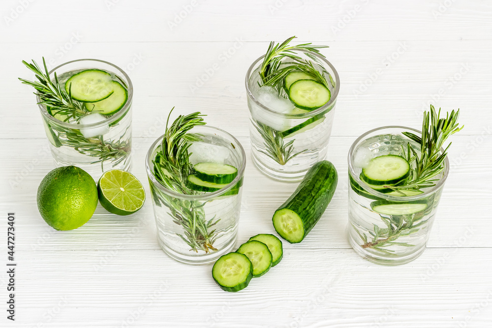 Lemonade with cucumber lime and herbs in glasses