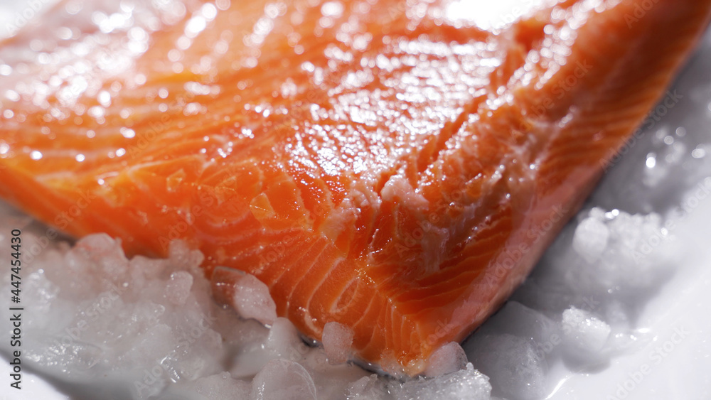 Salmon steaks and salmon fillet. Fresh salmon steaks and fillet are laid out on ice.