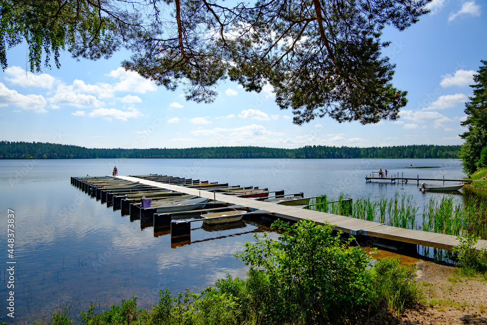 small boat harbour at lake bredsjön in the swedish nature reserve hökensas