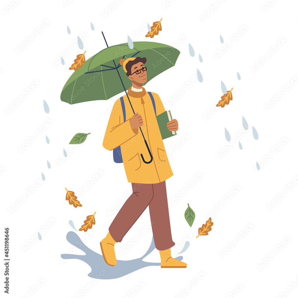 秋冷雨中行走的人，拿着书和伞的男性人物。青少年