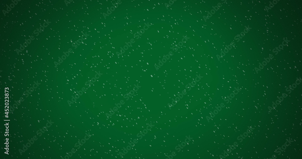 雪落在绿色背景下的冬季景色图像