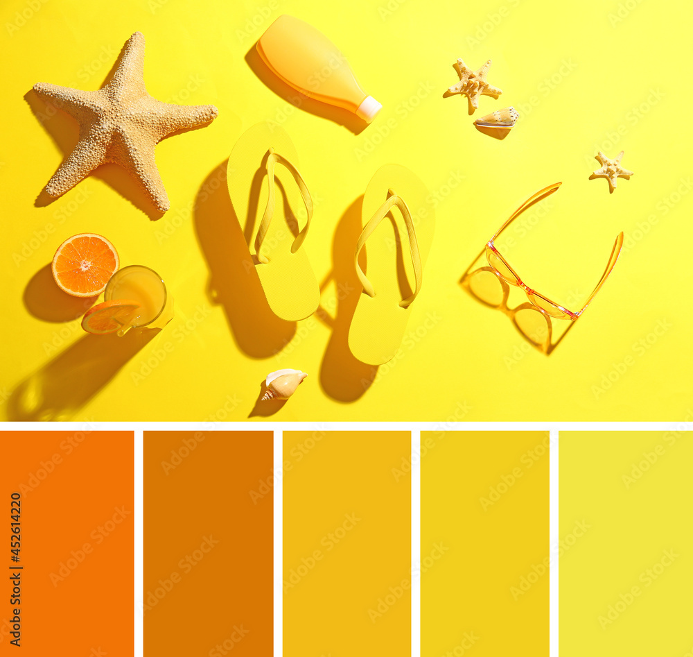 黄色背景下的海滩配饰和一杯果汁组成。不同的颜色图案