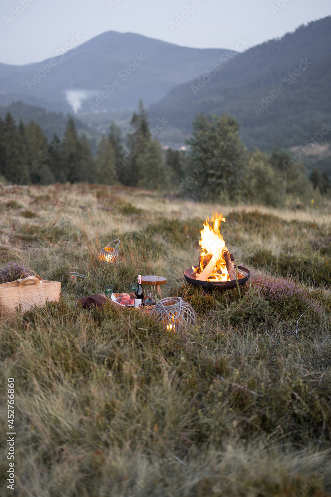 Beautiful picnic with a campfire in the mountains