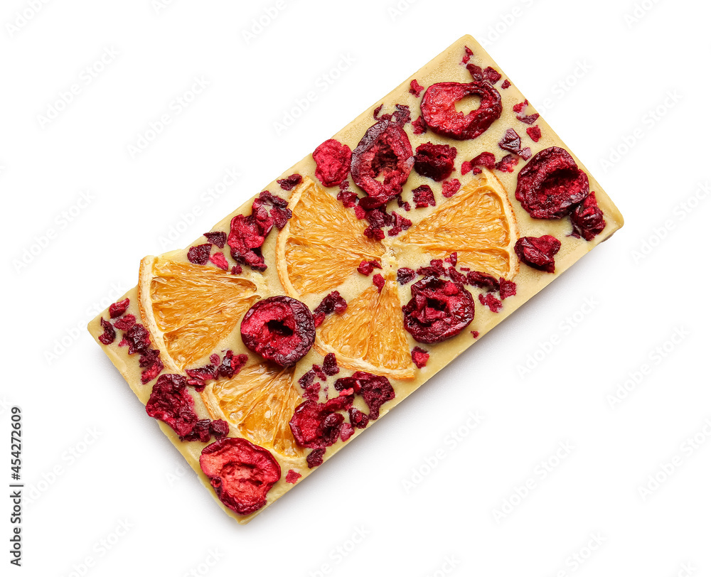 Handmade chocolate bar with fruits and berries on white background